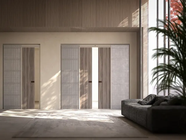 Porta filo muro modello ABS Evo di Ermetika. L'immagine mostra una porta elegante e minimalista, perfettamente integrata nella parete. Ideale per ambienti moderni, la porta è priva di cornici visibili e offre una soluzione di design pulita e funzionale.